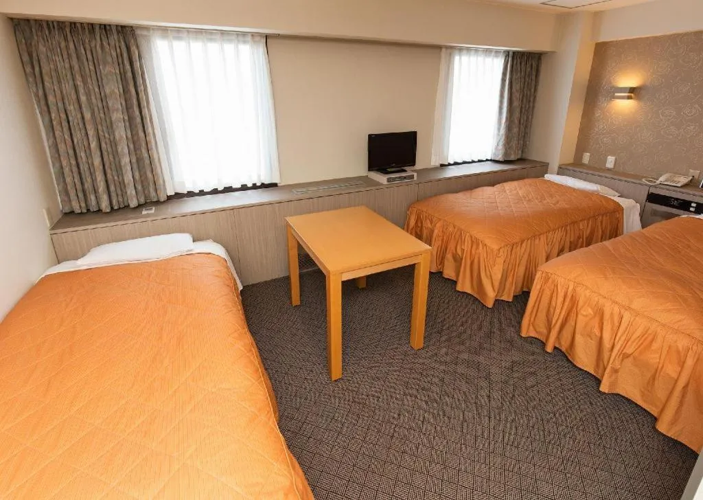 Bed in Hotel Suncity Ikebukuro