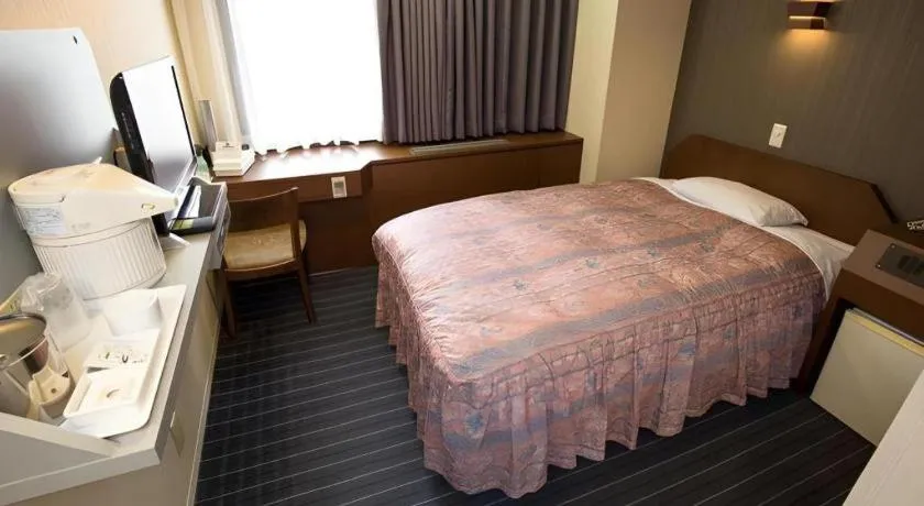 Bed in Hotel Suncity Ikebukuro