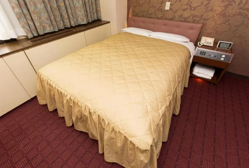 Bed in Hotel Suncity Ikebukuro