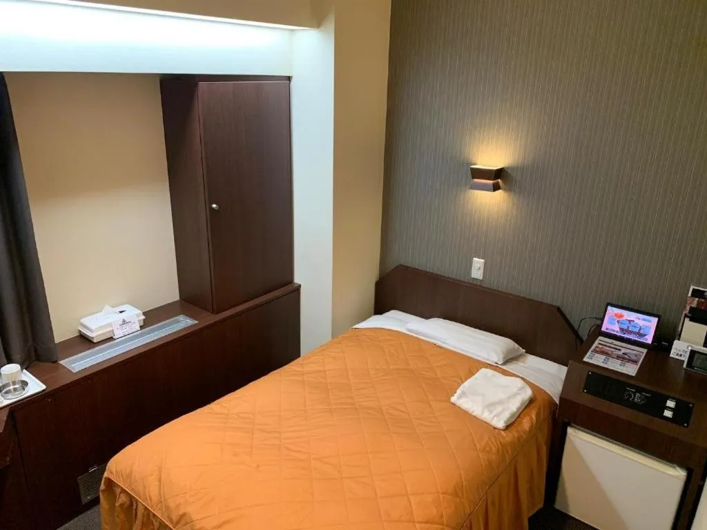 Bed in Hotel Suncity Ikebukuro