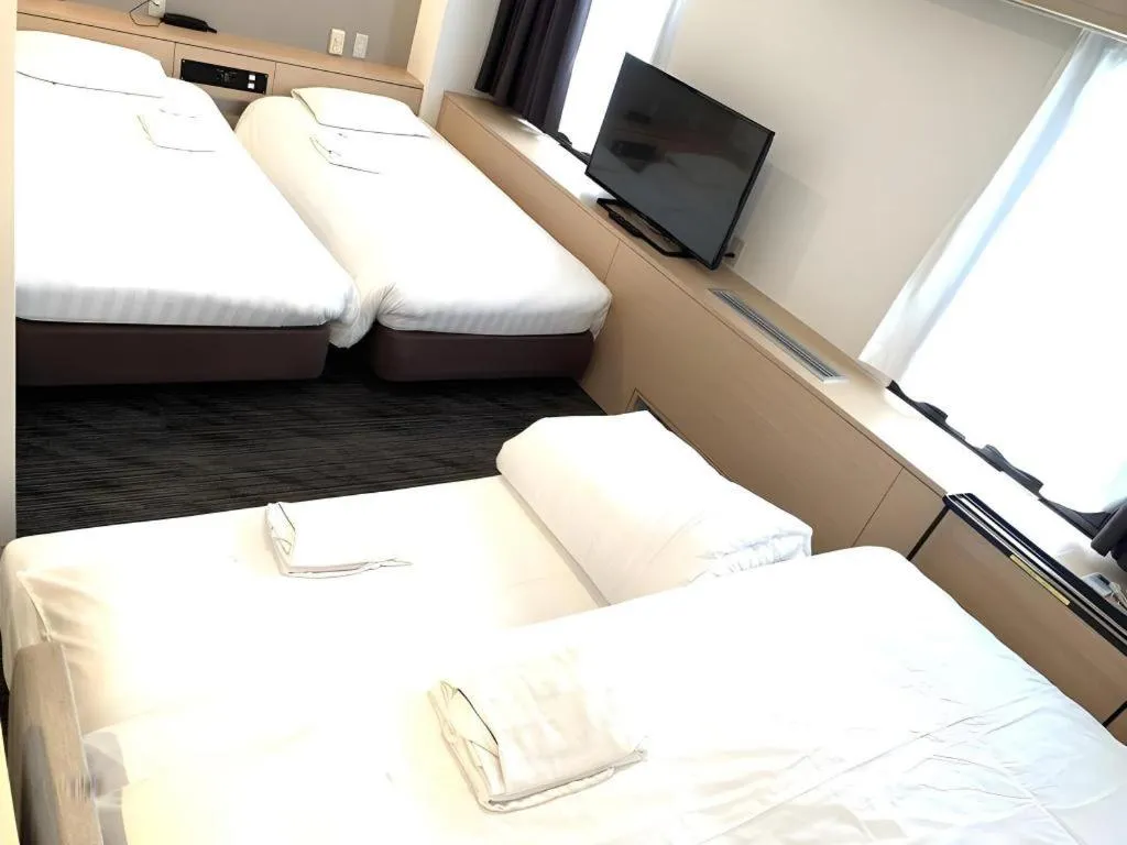 Bed in Hotel Suncity Ikebukuro