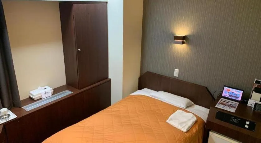 Bed in Hotel Suncity Ikebukuro