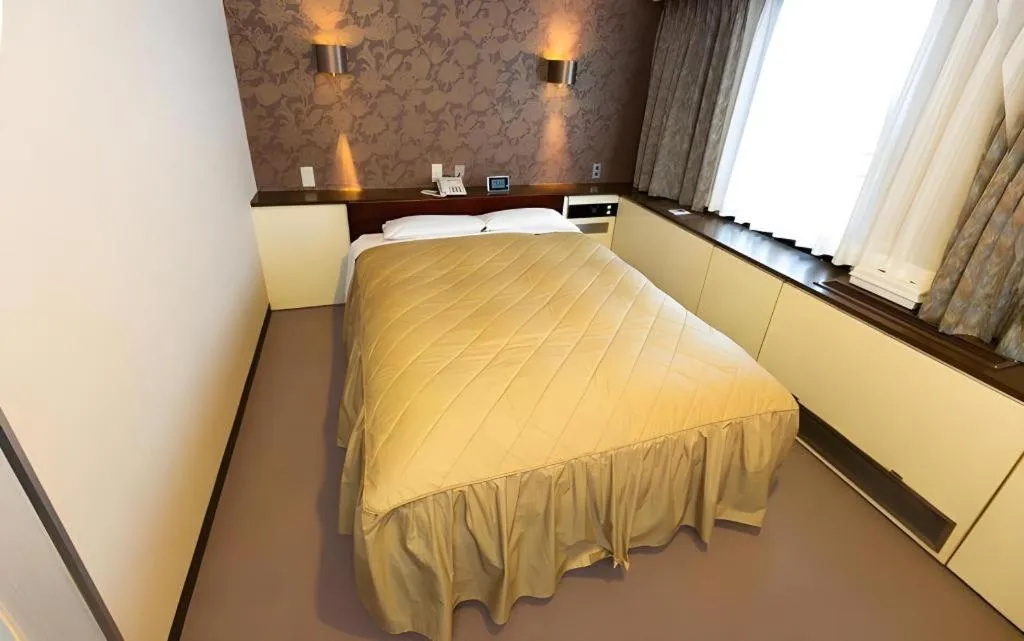 Bed in Hotel Suncity Ikebukuro