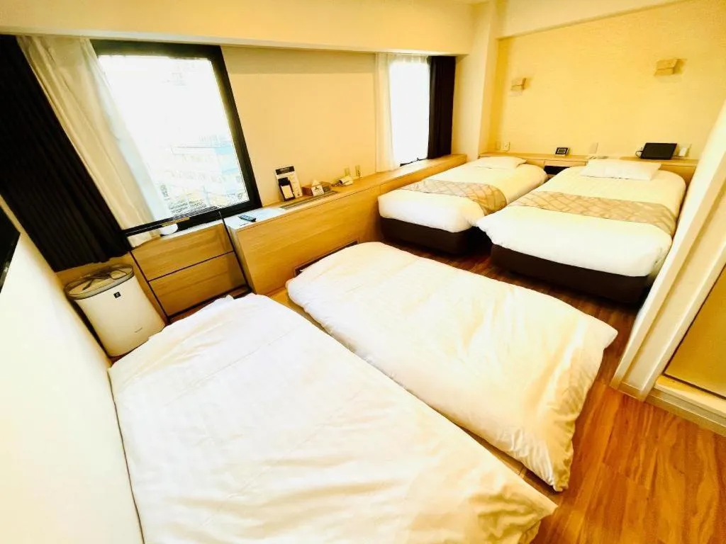 Bed in Hotel Suncity Ikebukuro