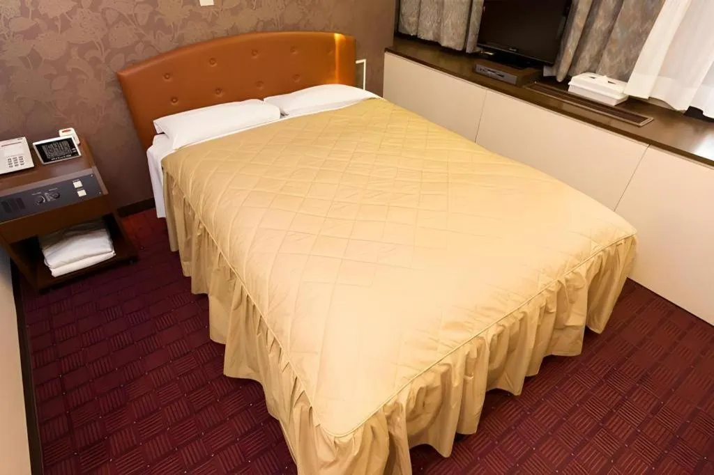 Bed in Hotel Suncity Ikebukuro