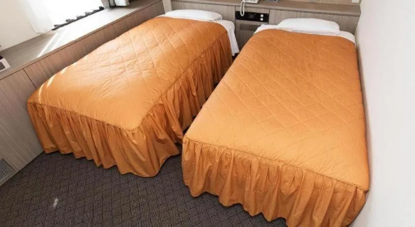 Bed in Hotel Suncity Ikebukuro