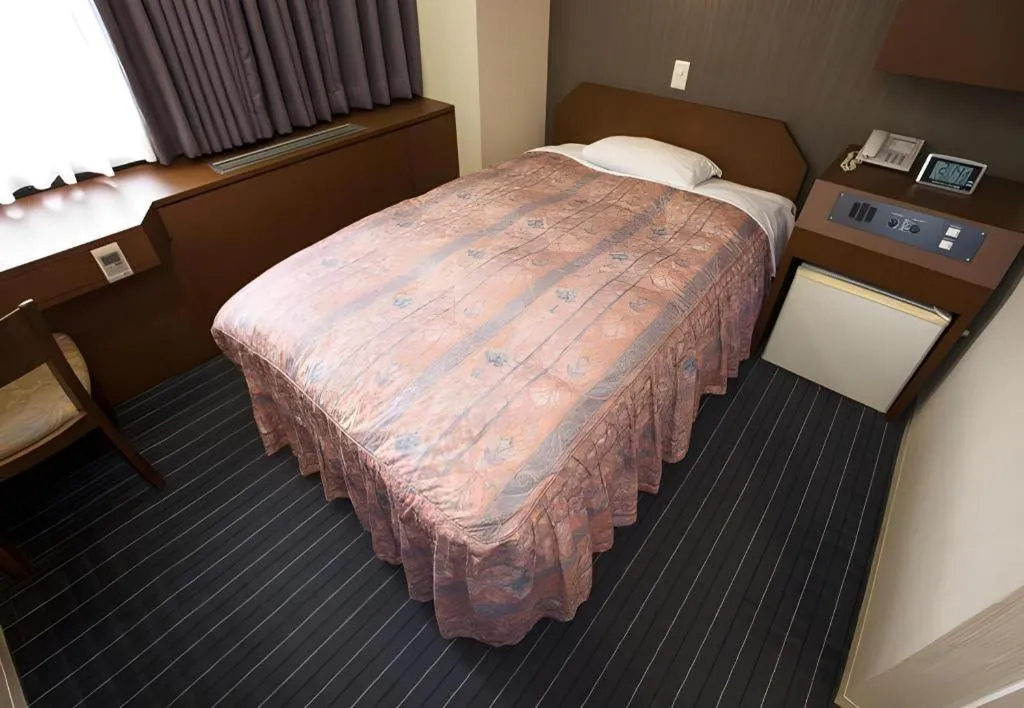 Bed in Hotel Suncity Ikebukuro