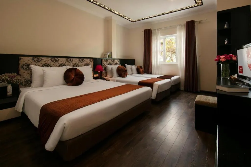 Bed in Serenity Premier Hotel