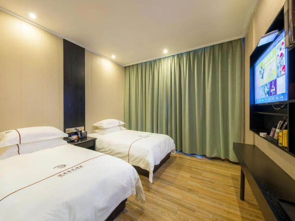 Bed in JIAN AI XI YUE HOTEL