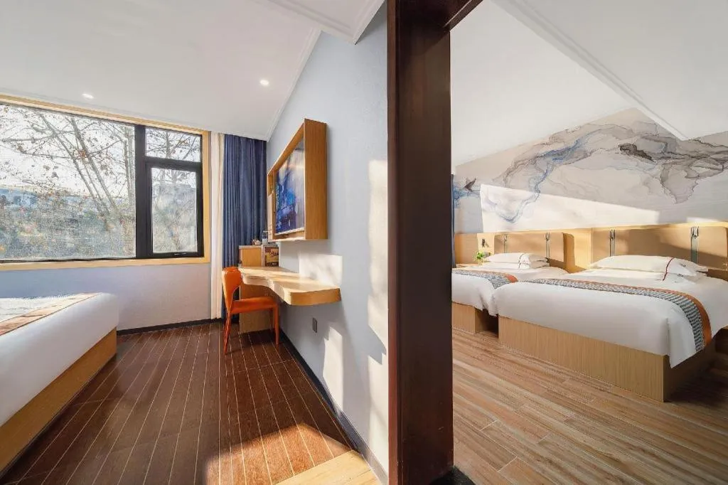 Bed in JIAN AI XI YUE HOTEL