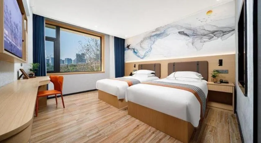 Bed in JIAN AI XI YUE HOTEL