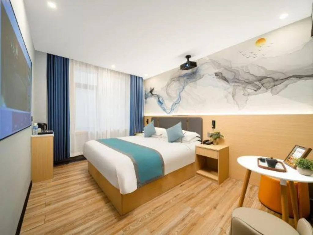 Bed in JIAN AI XI YUE HOTEL