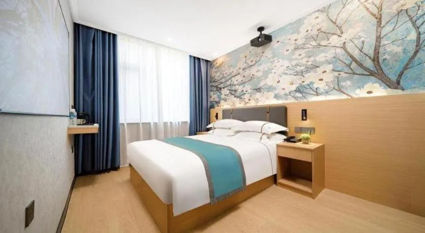 Bed in JIAN AI XI YUE HOTEL