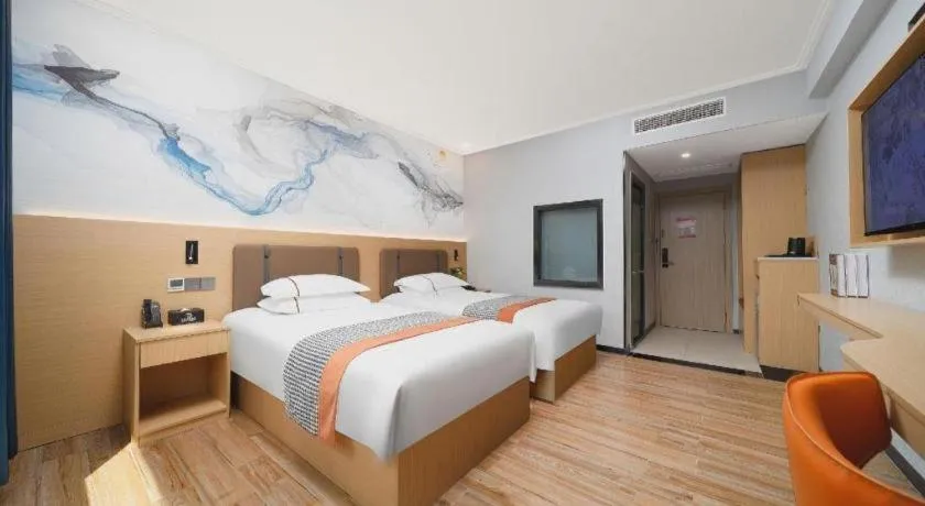 Bed in JIAN AI XI YUE HOTEL