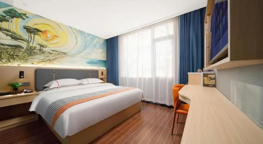 Bed in JIAN AI XI YUE HOTEL