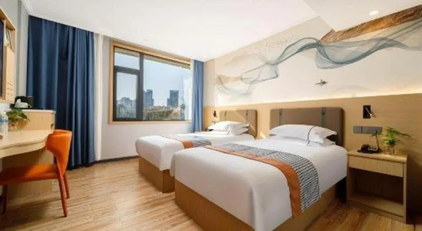 Bed in JIAN AI XI YUE HOTEL