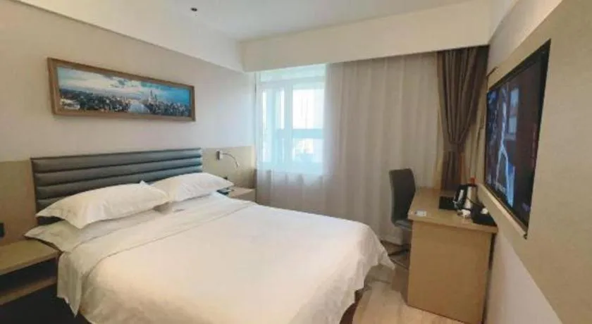 Bed in Metropolo Hotel Qingdao Wusi Square Xiaomaidao