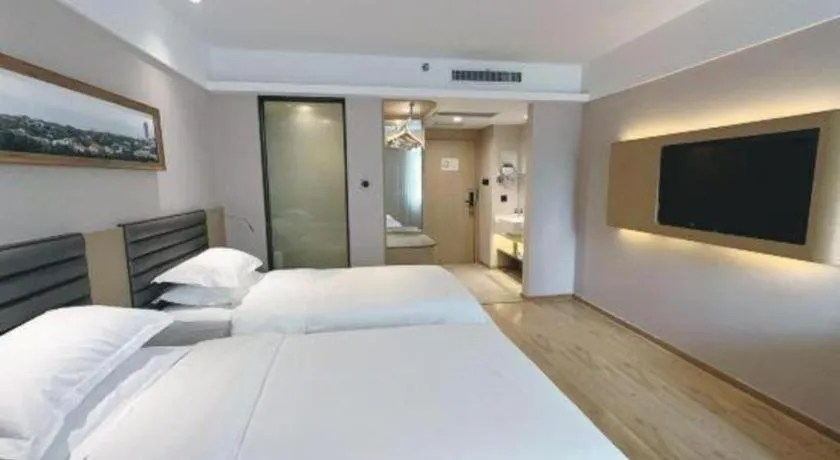 Bed in Metropolo Hotel Qingdao Wusi Square Xiaomaidao