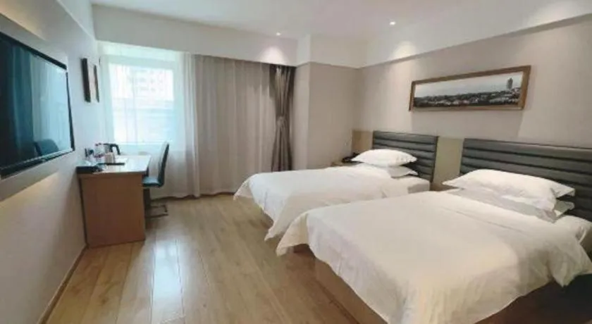 Bed in Metropolo Hotel Qingdao Wusi Square Xiaomaidao