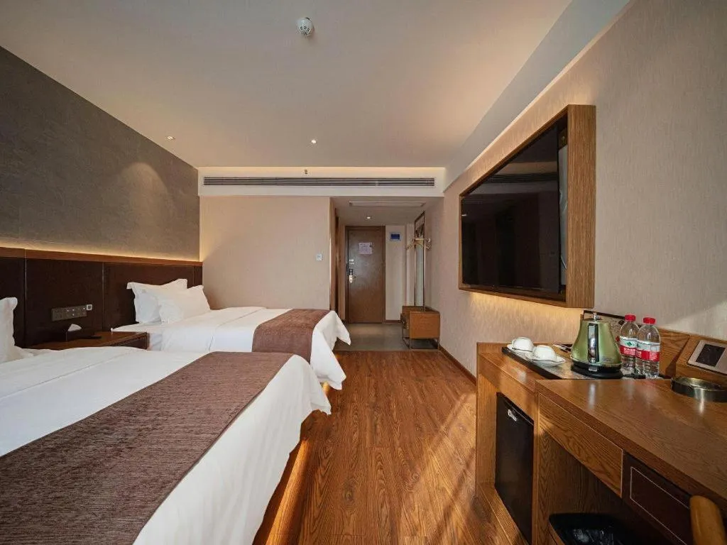 Bed in James Joyce Coffetel Xinyang Xixian Longhu Huayi