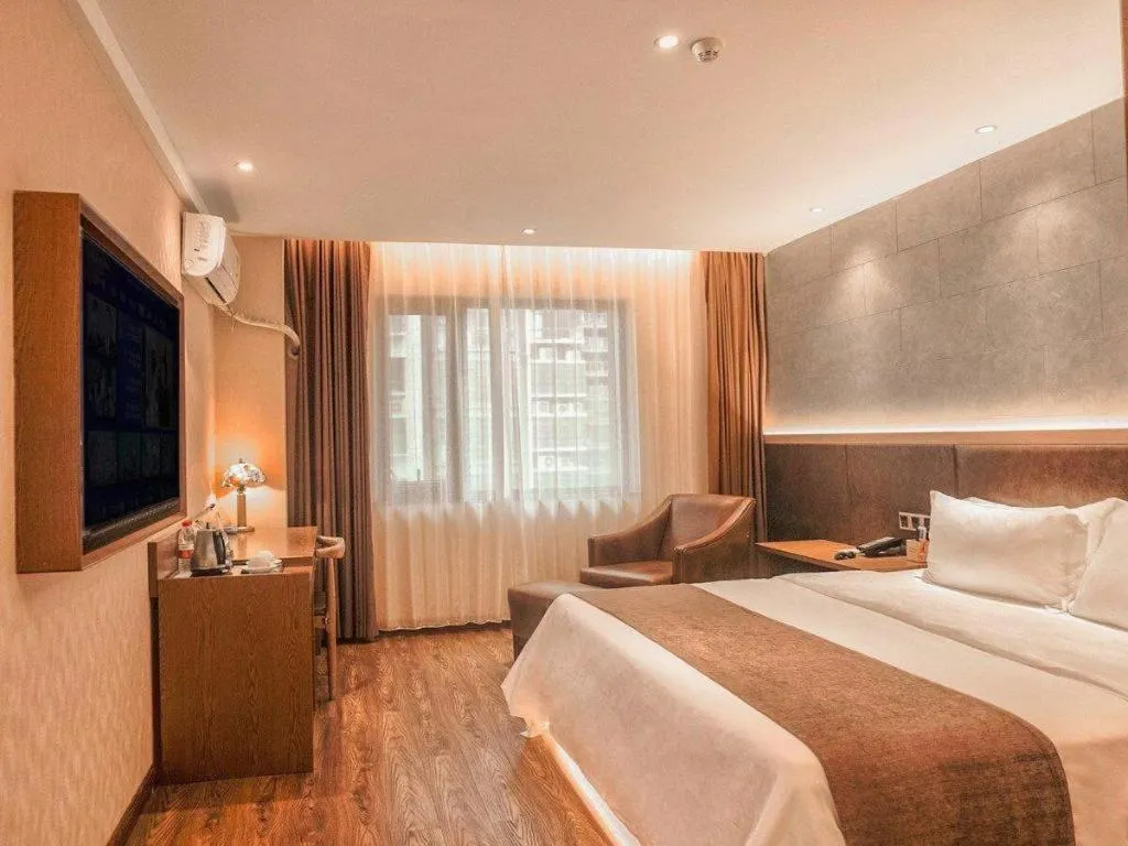 Bed in James Joyce Coffetel Xinyang Xixian Longhu Huayi