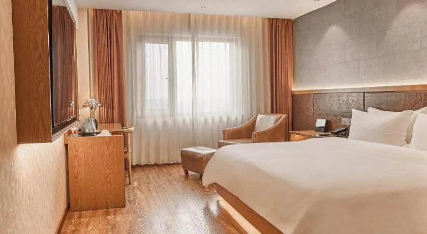 Bed in James Joyce Coffetel Xinyang Xixian Longhu Huayi