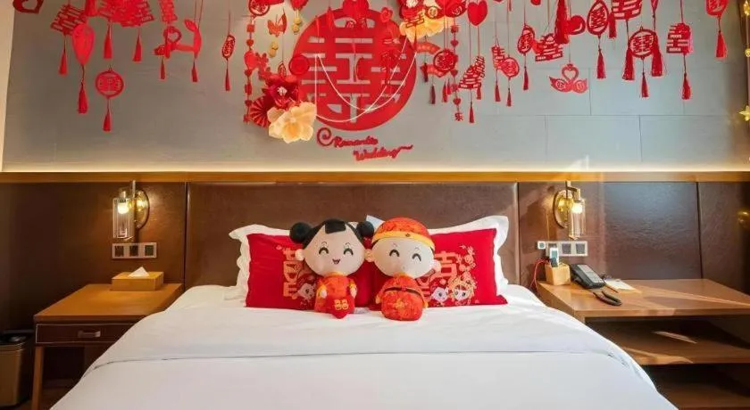 Bed in James Joyce Coffetel Xinyang Xixian Longhu Huayi