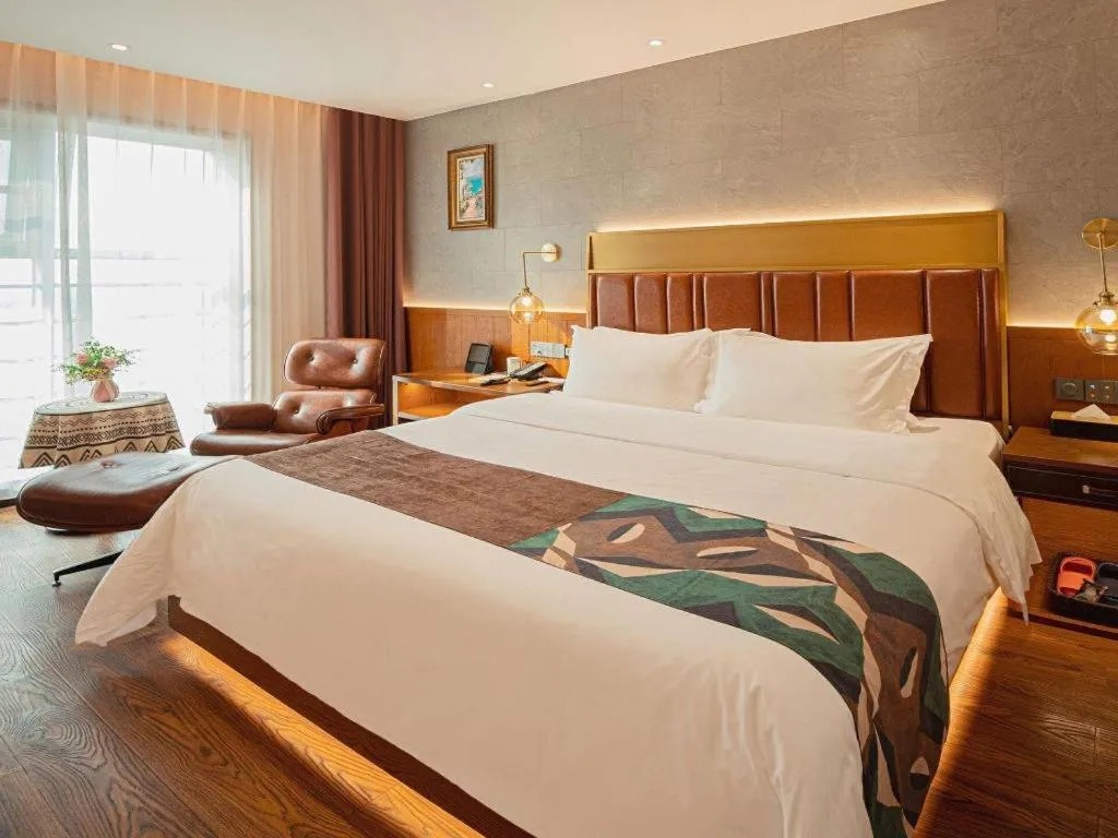 Bed in James Joyce Coffetel Xinyang Xixian Longhu Huayi