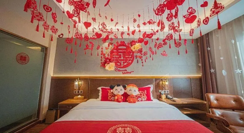 Bed in James Joyce Coffetel Xinyang Xixian Longhu Huayi