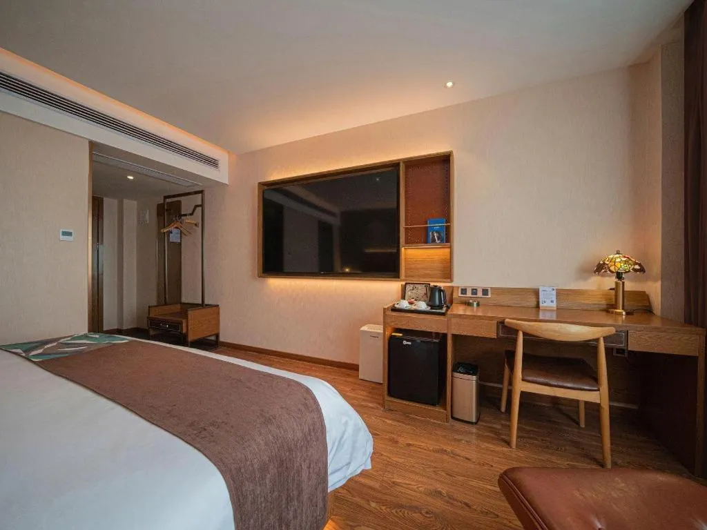 Bed in James Joyce Coffetel Xinyang Xixian Longhu Huayi