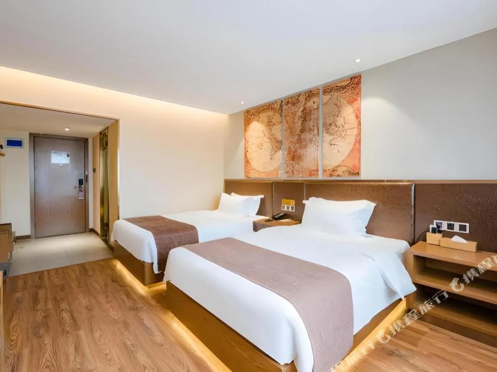 Bed in James Joyce Coffetel Xinyang Xixian Longhu Huayi