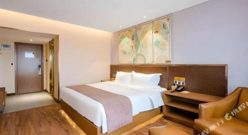 Bed in James Joyce Coffetel Xinyang Xixian Longhu Huayi