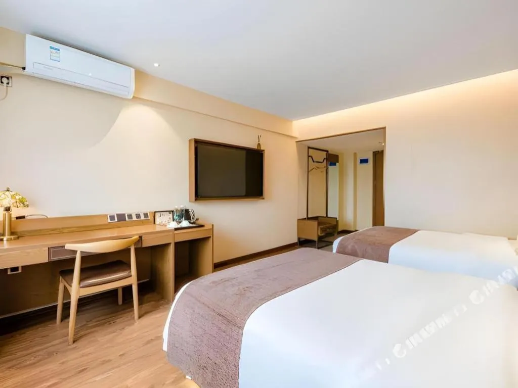 Bed in James Joyce Coffetel Xinyang Xixian Longhu Huayi