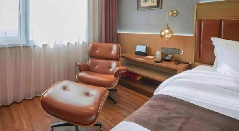 Bed in James Joyce Coffetel Xinyang Xixian Longhu Huayi