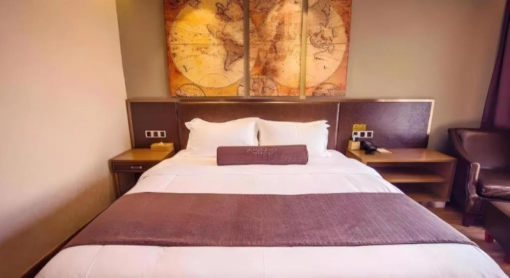 Bed in James Joyce Coffetel Xinyang Xixian Longhu Huayi