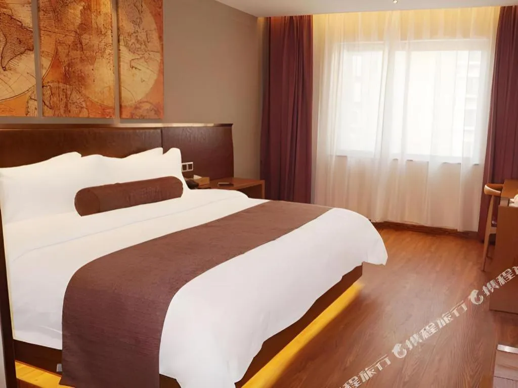 Bed in James Joyce Coffetel Xinyang Xixian Longhu Huayi