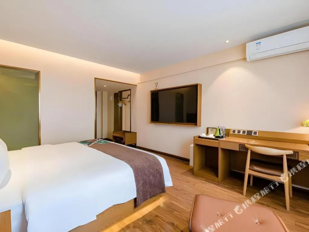 Bed in James Joyce Coffetel Xinyang Xixian Longhu Huayi