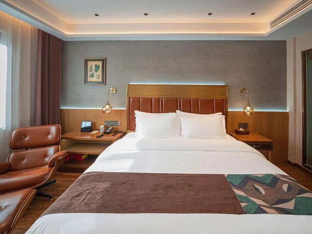 Bed in James Joyce Coffetel Xinyang Xixian Longhu Huayi