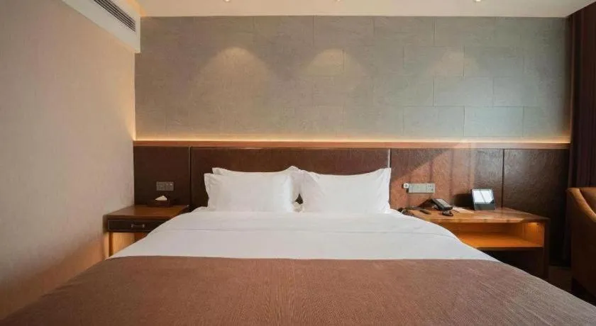 Bed in James Joyce Coffetel Xinyang Xixian Longhu Huayi