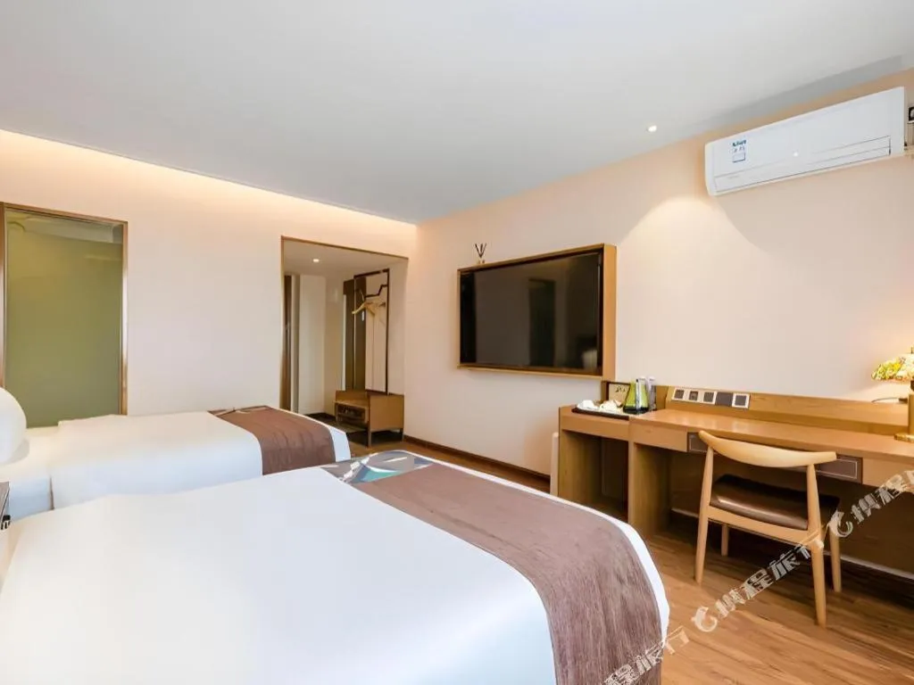 Bed in James Joyce Coffetel Xinyang Xixian Longhu Huayi