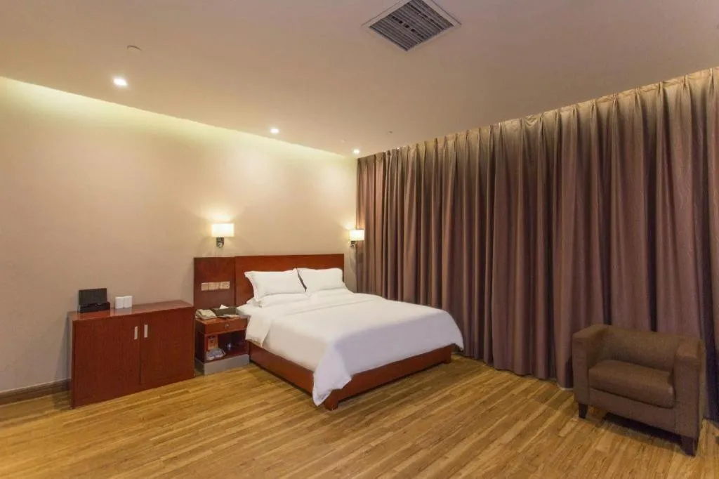 Bed in PAI Hotel Guangzhou North Gate of Chimelong Zoo