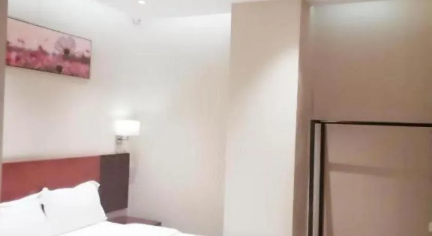 Bed in PAI Hotel Guangzhou North Gate of Chimelong Zoo