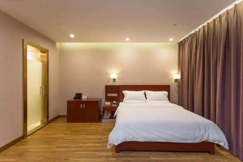 Bed in PAI Hotel Guangzhou North Gate of Chimelong Zoo