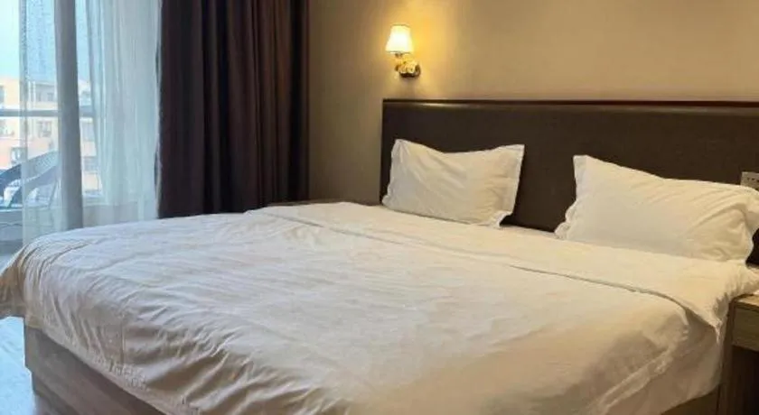 Bed in PAI Hotel Guangzhou North Gate of Chimelong Zoo