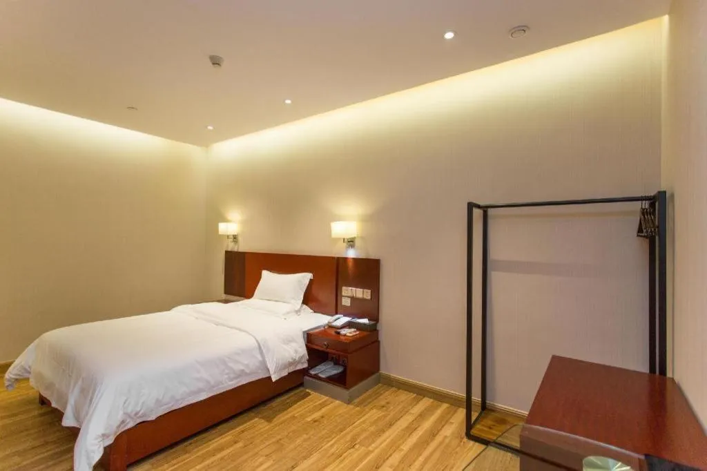 Bed in PAI Hotel Guangzhou North Gate of Chimelong Zoo