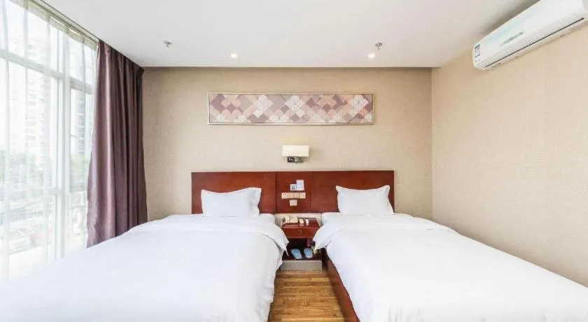 Bed in PAI Hotel Guangzhou North Gate of Chimelong Zoo