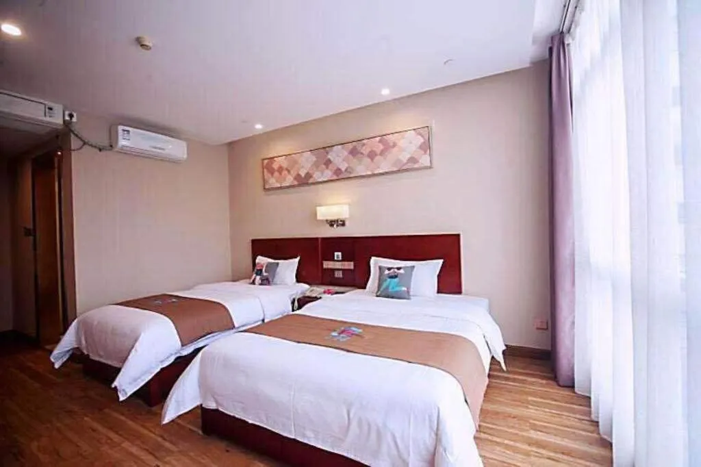 Bed in PAI Hotel Guangzhou North Gate of Chimelong Zoo