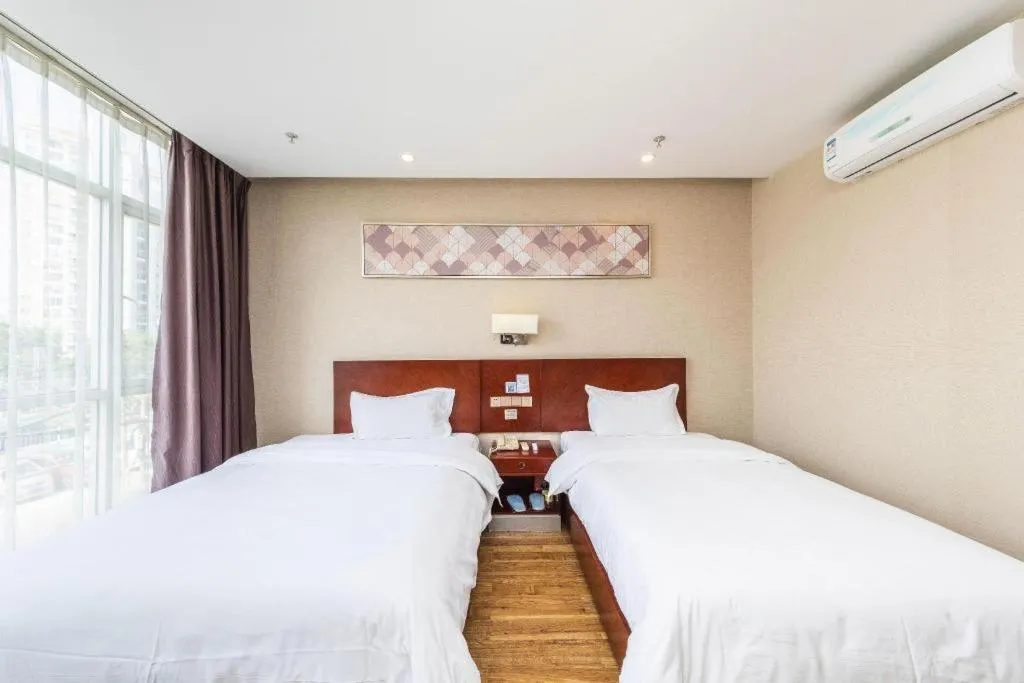 Bed in PAI Hotel Guangzhou North Gate of Chimelong Zoo