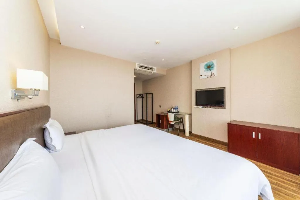 Bed in PAI Hotel Guangzhou North Gate of Chimelong Zoo