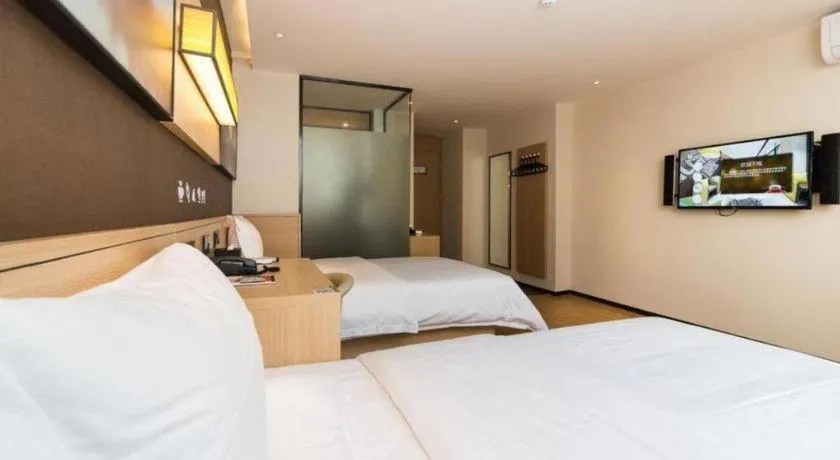 Bed in IU Hotels Guangzhou Panyu Dashi Chimelong Safari Park